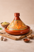 Hand-painted Moroccan cooking tagine with orange floral design, handmade in Morocco